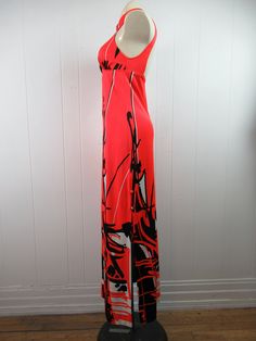 "Vintage 1960s early 70s maxi dress. Made of polyester. Color is red, black and white. Asian inspired. Has a halter style collar with three buttons. Empire waist. Floor length. Made by Jantzen. Size medium. Actual measurements are: 25\" (stretches to 29\") around the waist 32\"(stretches to 36\") around the hips 60\" overall length 29.5\" side vents In very good condition." Red Retro Maxi Dress For Summer, Retro Red Maxi Dress For Spring, Red Retro Maxi Dress For Spring, Red Sleeveless Lined Maxi Dress, Red Full-length Maxi Dress For Summer, Retro Sleeveless Party Maxi Dress, Retro Sleeveless Maxi Dress For Party, Retro Fitted Sleeveless Maxi Dress, Red Lined Maxi Dress For Evening