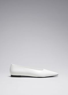 These timeless elegant ballerina flats are crafted from supple leather in Portugal. They feature sharply pointed toes and rest on slight heels. Classic Flat Court Shoes For Spring, Elegant Slip-on Flats With Sculpted Heel, Formal Slip-on Ballet Flats With Low Heel, Sleek Ballet Flats For Formal Occasions, Sleek Ballet Flats With Branded Insole, Formal Flats With Sculpted Heel And Pointed Toe, Elegant Business Ballet Flats Slip-on, Sleek Formal Slip-on Ballet Flats, Sleek Spring Ballet Flats With Almond Toe