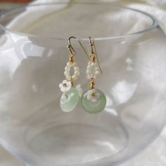 ⭐️ Introducing our Chinese vintage style dangles that the dangly part is made in synthetic jade that's in a light green color with beaded flowers surrounding.  ⭐️ The dangles showcase intricately designed Chinese elements, adding a cute and elegant touch to your look. ⭐️ Crafted with hypoallergenic materials, these earrings offer a comfortable and safe wearing experience.  ⭐️ The lightweight design makes them perfect for everyday wear or as an exquisite accessory for formal events. ⭐️ Ideal for various occasions, including weddings, parties, or adding a touch of elegance to your daily outfits. ⭐️ It also goes very well with Chinese Qipao dress or Hanfu. ✈️ Handling & Shipping usually takes about 10 days in total, so please consider the processing time if it's a time sensitive gift. 🌹 We a Jade Beaded Drop Earrings, Green Jade Dangle Beaded Earrings, Green Jade Beaded Drop Earrings, Green Jade Beaded Earrings For Gift, Jade Earrings With Dangling Beads As A Gift, Jade Beaded Dangle Earrings For Gift, Adjustable Jade Beaded Dangle Earrings, Birthday Gift For Best Friend, Chinese Vintage