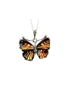 This special piece is a pendant of a butterfly, reverse-carved by skilled artisans using genuine Baltic amber. Each piece is painstakingly carved from the backside using different depths to create a detailed image on the front. Set in sterling silver, and comes on an adjustable 16-18" cable chain. Pendant is 1" long. Crystal Accessories, Butterfly Necklace, Chain Pendant, A Butterfly, Baltic Amber, Toe Rings, Stone Bracelet, Detailed Image, Sterling Ring