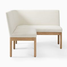 a white chair with a wooden frame and foot rest in front of it on a white background