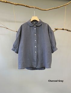 "Seamless combination of Peter Pan and boyfriend shirt. This button down blouse is very versatile. Tucked in, you got the vintage look with its Peter Pan collar; un-tucked, you look young and relaxed with the slightly puffed sleeves. Either way, you just look elegant in and out. -100% linen construction -Peter pan collar -Buttoned front -Elbow length puffed sleeves -Buttoned cuff -High-low hem Please provide your shoulder width, full bust measurement ( measured around the fullest part) and your Relaxed Fit Blouse With Button Closure And Collar, Relaxed Fit Collar Top With Button Closure, Linen Workwear Blouse With Collar, Linen Blouse With Collar For Workwear, Relaxed Fit Blouse With Buttons And Collared Neckline, Relaxed Fit Tops With Cuffed Sleeves And Spread Collar, Collared Tops With Cuffed Sleeves, Collared Linen Blouse With Button Cuffs, Spring Tops With Cuffed Sleeves And Collared Neckline