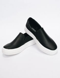 Black slip on sneaker with white rubber sole Synthetic Slip-ons With White Sole For Streetwear, Comfortable Synthetic Slip-on Sneakers For Streetwear, Black Synthetic Slip-on Sneakers With Vulcanized Sole, Black Synthetic Slip-ons For Streetwear, Synthetic Round Toe Slip-ons For Streetwear, Textured Sole Synthetic Slip-ons For Streetwear, Trendy Black Low-top Slip-ons, Trendy Black Synthetic Slip-ons, Black Trendy Low-top Slip-ons