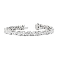 The eternal classic charts a new course with this north-south diamond tennis bracelet. Heart-shaped diamonds secured by v-prongs line up in alternating north-south settings, with the heart's pointed tip alternately pointing up and down. The shift creates a chic and modern appearance while maintaining an air of timelessness. Blue Wedding Band, Something Blue Wedding, Bracelet Heart, Diamond Tennis Bracelet, The Shift, Diamond Anniversary Rings, Heart Shaped Diamond, North South, Mens Band