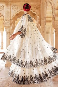 White tiered lehenga with thread embroidered floral blossom patterns, embellished by mirrorwork. Comes with matching padded blouse and flared jacket. - Aza Fashions Floor-length Chikankari Embroidered Dress For Festive Occasions, Festive Floor-length Chikankari Embroidered Dress, Festive Chikankari Embroidered Floor-length Dress, Bohemian Sets With Intricate Embroidery For Reception, Traditional Sharara With Floral Embroidery, Embroidered Maxi Length Sharara For Navratri, Diwali Embroidered Maxi Choli, Traditional Maxi Length Sharara With Floral Embroidery, Chikankari Embroidery Maxi Set For Reception