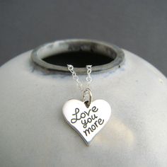 "sterling silver love you more necklace - A small solid sterling silver heart pendant, measuring just under 5/8\" (14 mm) across, 1/2\" (13 mm) down, a nice 16 gauge thick (1.2 mm). - Words are etched, so they are perfectly aligned. Details blackened (oxidized) to stand out. - Necklace is 1.5 mm sterling silver cable chain, length customizable at drop down menu. High quality lobster clasp and locking jump rings, all solid sterling silver. - Smooth on back, with a tiny 925 mark on back. - Package Quote Affirmation, Love Word, Sterling Silver Cleaner, Romantic Jewelry, Sterling Silver Heart Pendant, Romantic Jewellery, Silver Heart Pendant, Gift Love, Jewelry Model