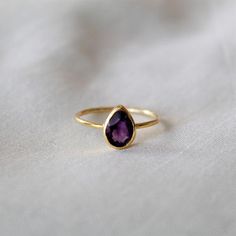 D E T A I L S - Material: 925 Sterling silverStone: Natural Amethyst RingThe fit: True to US ring size Finish: Smooth and Gold Plated to a high shineS H I P P I N G & P R O D U C T I O N - My current production time is 2-6 business days, which means after those days are up, your order ships! I make everything custom to order, by hand, but I promise you it's worth the wait!R U S H - M Y - O R D E R -If you're in a rush to get your pretty new pieces, please send me a message and I'll let you k Fine Jewelry Teardrop Purple Ring, Fine Jewelry Purple Teardrop Ring, Purple Teardrop Fine Jewelry Ring, Dainty Faceted Round Rings, Teardrop Gemstone Promise Ring, Fine Jewelry Crystal Teardrop Ring, Teardrop Crystal Ring Fine Jewelry, Teardrop Amethyst Ring In Purple, Teardrop Amethyst Ring For Gift