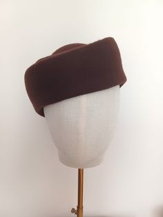 * Materials: This elegant  hat is made with high quality wool felt capeline in Dark Brown color. *Product info:  The felt capeline is stiffened with felt stiffener ( no smell ). It can be made in different sizes and colors. If you want to customize this item or you want another color that do not appear in the *variations box * contact with me . It will be my pleasure to create a custom headpiece for you. This headpiece is made with high quality materials , using traditional millinery tecniques. Vintage Fall Felt Hat, Retro Curved Brim Felt Hat For Winter, Vintage Solid Felt Hat For Winter, Classic Wool Beret With Short Brim, Classic Felt Cap For Winter, Classic Winter Felt Cap, Classic Fitted Felt Cap, Classic Brimmed Wool Beret, Vintage Brown Beret For Winter