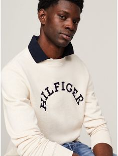 Tommy Hilfiger men's sweatshirt. For chilly days or lounging around, reach for this cozy sweatshirt made from heavy French terry cotton printed with our arched Hilfiger logo on the chest.  Material: 61% Cotton (rgc), 39% Transitional Cotton ,  In-conversion. Logo Print Sweater For Winter Loungewear, Tommy Hilfiger Cotton College Tops, Casual Tommy Hilfiger Tops For College, Tommy Hilfiger Casual Tops For College, Sporty Cotton Sweater With Logo Detail, Casual College Sweatshirt With Logo Detail, Casual College Sweatshirt With Logo, Winter Loungewear Sweatshirt With Logo, Winter Loungewear Tops With Logo Detail