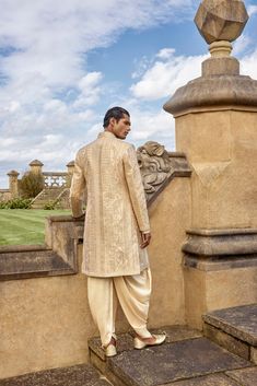 This set features lurex ribbon embroidery in an abstract pattern. It is paired with a matching silk kurta and silk dhoti salwar.From Seema Gujral's A Royal Affair collection. DELIVERY TIMEPlease allow 8-12 weeks for your outfit to arrive. FABRIC DETAILSSherwani- Raw SilkKurta - SilkAfghani Salwar -Silk Professional cleaning only.