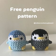 two small crocheted penguins sitting next to each other on a white surface with the text free penguin pattern