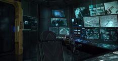 a computer room with many monitors and screens on the wall, all in dark colors