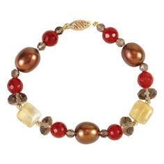 Such a great look on this 100% 14K yellow gold, pearl and genuine gemstone bracelet. The bracelet contains 3 rich chocolate brown freshwater pearls, 6 round carnelian gemstones, 2 square citrine gemstones and several smoky quartz gemstone accents.  You will love the variety of shapes and colors in this lovely pearl and gemstone bracelet.  Pearls and gemstones have 14K yellow gold bead accents and a secure 14K gold clasp.  Chunky bracelet is a total of 7.5 inches in length.   Makes for a unique and affordable gift idea.  A FREE Gift Box is included with your purchase.   Pearls:  10.5 - 11.5mm Oval Chocolate Pearls Gemstones:  Various sizes of Genuine Carnelian, Citrine & Smoky Quartz Gold Weight:  .35 grams of 14K (Smalls beads & clasp) Length:  7.5 inches Elegant Red Carnelian Bracelet, Elegant Round Carnelian Bracelets, Elegant Carnelian Gemstone Bracelets, Gold Carnelian Bracelet, Elegant Amber Beaded Bracelets With Natural Stones, Elegant Brown Natural Stone Jewelry, Elegant Amber Beaded Bracelet With Gemstones, Elegant Amber Beaded Bracelets, Elegant Brown Gemstone Beaded Bracelets