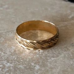 a gold ring sitting on top of a table