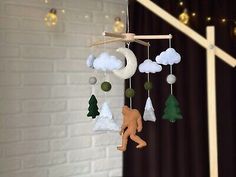 a baby crib mobile is hanging from the ceiling