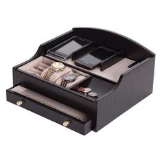 an open black leather jewelry box with two cell phones and other accessories in it on a white background