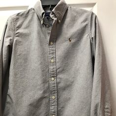 Like New. Probably Never Worn Or Worn Only Once. Gray Button-up Top With Button Cuffs, Ralph Lauren Collared Tops For Fall, Ralph Lauren Collared Fall Tops, Classic Gray Button-up Top, Ralph Lauren Button-up Tops For Business Casual, Gray Button-up Shirt For Spring, Gray Button-up Top With Snap Buttons, Spring Gray Button-up Shirt, Gray Button-up Business Casual Tops