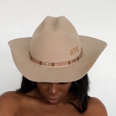 The Upland Western Cowboy Hat seamlessly blends the rustic charm of the Wild West with a dash of futuristic boho flair. With its distinctive cowboy silhouette, complete with a cattleman creased crown and a stylish upturned brim, this hat exudes classic Texan allure. The leather band is adorned with gleaming silver jewels, adding a contemporary twist to this timeless fashion statement. Handcrafted and meticulously embroidered with the initials "BTR," this hat exemplifies the perfect fusion of tra Western Style Wide Brim Rigid Hat, Western Wide Brim Hat With Rigid Fit, Western Fedora With Short Brim For Western-themed Events, Rigid Wide Brim Western Hat, Rigid Hat With Curved Brim For Western-themed Events, Rigid Wide Brim Hat For Rodeo, Rigid Curved Brim Hat For Western-themed Events, Rigid Flat Brim Hat For Country Events, Western Curved Brim Hat For Rodeo