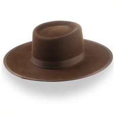 Description Materials Craftsmanship Hat Care Shipping Returns Product Description A Classic Brown Western Cowboy Hat Step into rugged elegance with the Vanguard, a brown western cowboy hat handcrafted from high-quality rabbit fur felt. Featuring a 4 1/2" telescope crown and a 3 5/8" ribbon-bound flat brim, this hat offers a perfect blend of classic western style and modern sophistication. The grosgrain ribbon hatband adds refined detail, while the custom fit ensures all-day comfort. Delivered in Homburg Hat, Brown Cowboy Hat, Gambler Hat, Outdoor Hut, The Raid, Mens Hats Fashion, Fedora Hat Men, Homburg, Chapeau Cowboy