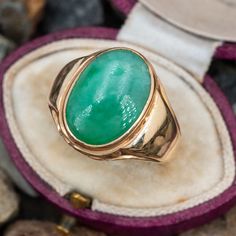 This handsome vintage mens ring is bezel set with an oval cabochon jadeite jade. The ring is crafted in 10k yellow gold with a nice patina and is currently a size 10. Antique Oval Emerald Ring, Vintage Oval Jade Emerald Ring, Vintage 14k Gold Oval Cabochon Emerald Ring, Vintage 14k Gold Emerald Oval Cabochon Ring, Classic Oval Emerald Collectible Ring, Classic Oval Emerald Ring Collector's Item, Green Oval Signet Ring Collectible, Vintage Green Signet Ring With Polished Finish, Vintage Green 14k Gold Signet Ring