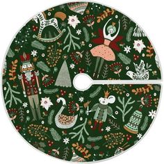 a green christmas tree skirt with animals and trees on it