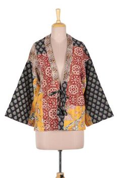 A mixed-print patchwork and kantha embroidery lend a wonderfully bohemian attitude to this kimono-style jacket. Crafted of all cotton the jacket features a front tie and flared sleeves. Designer Jay Kumar Maheshwari presents the jacket which is crafted by local artisans in Jaipur India. Long Sleeve Boho Print Outerwear For Fall, Patterned Patchwork Outerwear For Fall, Bohemian Spring Patterned Outerwear, Bohemian Patterned Spring Outerwear, Spring Bohemian Patterned Outerwear, Spring Multicolor Floral Patchwork Outerwear, Printed Cotton Fall Outerwear, Printed Cotton Outerwear For Fall, Multicolor Cotton Outerwear For Summer