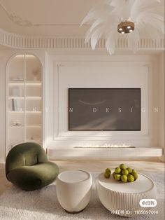 a living room with white furniture and a flat screen tv mounted on the wall above it