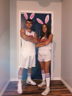 a man and woman in bunny ears are posing for a photo