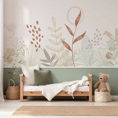 a room with a bed, teddy bear and wall mural