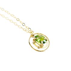 A unique pendant with a bright, clear genuine oval peridot gemstone. The beautiful lime-green color of this peridot sparkles brightly in the light! The gemstone "floats" in a gold circle ring for a distinct look.MATERIALGold filled chainGold filled wireGenuine gemstone SIZE20mm circle ring18" chain11x9mm peridot CLOSURELobster claspWHAT IS FILLED GOLD?We used to have just 2 choices: pure gold or gold plate. The first was very expensive and the second was…well…not very good.Our gold filled jewelr Lime Green Peridot Jewelry For May Birthstone, Modern Yellow Gold Peridot Jewelry, Modern Gold Jewelry With Peridot, Modern Green Peridot Jewelry, Modern Green Circular Jewelry, Peridot Birthstone Jewelry In Round Shape, Peridot Birthstone Jewelry With Round Shape, Round Peridot Birthstone Jewelry, Oval Peridot Green Jewelry