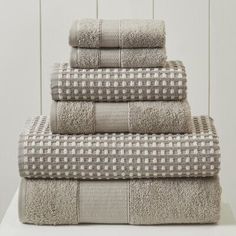 four towels stacked on top of each other