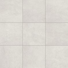 a white tile wall with several squares in the middle and one square at the top