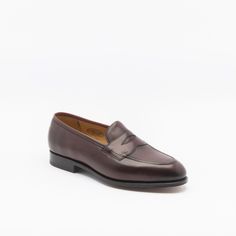 Burgundy antique calf penny loafer with single leather sole. Fitting F, last 184. Made in England Classic Italian Moccasins For Semi-formal Occasions, Classic Italian Moccasins With Almond Toe, Classic Brogue Moccasins For Galas, Classic Moccasins With Brogue Detailing For Galas, Classic Brogue-detailed Moccasins For Galas, Classic Italian Slip-on Dress Shoes, Classic Cap Toe Loafers With Leather Sole, Classic Wingtip Loafers For Galas, Classic Cap Toe Loafers For Galas