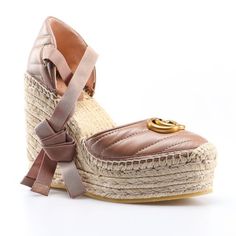 The Gucci Gg Matelasse Leather Platform Espadrilles In Rose Tan Is Crafted In Italy From Raffia And Smooth Leather. These Wedge Heels Feature A Zig Zag, Matelasse Pattern, Espadrille Sole With A Wedge Heel And Platform, Gg Logo At The Front And Tie Ankle Strap. Rose Tan Gg Matelasse Leather Platform Espadrilles Beige Heel 100% Leather Raffia Sole And Heel Wedge Heel Shoes Gg Logo Tie Ankle Strap Almond Shaped Toe Size 39.5 2.5" Platform 4.5" Heel Product Number 573023 Made In Spain Gucci Leather Espadrilles For Beach, Gucci Leather Beach Espadrilles, Chic Beige High Heel Espadrilles, Gucci Leather Heels For Spring, Brown Espadrille Heels With Round Toe, Brown Gucci Heels For Summer, Gucci Brown Summer Heels, Luxury Spring Flat Espadrilles, Gucci Round Toe Heels For Spring