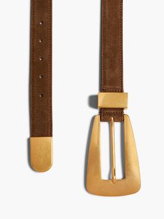 Khaite's Lucca Belt is a sleek calfskin belt with an elongated trapezoidal buckle. The polished hardware—buckle, loop, and curved tip—is made of gold-plated brass. Belt Gold, Leather Outerwear, Suede Belt, Antique Hardware, Boot Pumps, Belt Accessories, Fine Jewelry Designers, Pumps Flat, Lucca