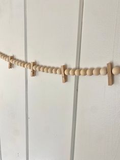 some wooden pegs are hanging on the wall