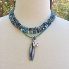 "All the colors of the ocean are combined in this long beaded necklace. Turquoise, lapis, larimar, blue agate and more! Wear this necklace single or double. Beautiful by itself or layer it with your other favorite pieces to create your own color story. Necklace: 37\" plus extender Layer this necklace with: https://www.etsy.com/listing/548308190/turquoise-and-diamonds-pendant-turquoise?ref=shop_home_active_159&frs=1&crt=1 or: https://www.etsy.com/listing/818339679/turquoise-necklace-handk Rose Cut Diamond Pendant, Diamond Charm Necklace, Diamond Star Necklace, Pearl Lariat Necklace, Hand Knotted Necklace, Lapis Necklace, Necklace Colorful, Gemstone Beaded Necklace, Baroque Pearl Necklace