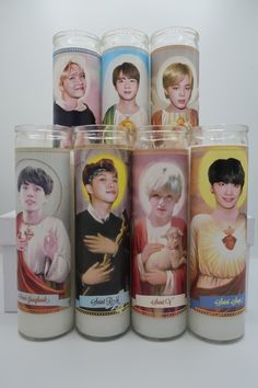 five candles with pictures of people on them