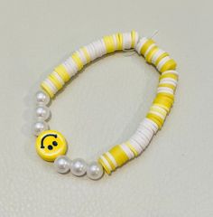 yellow smiley face clay bead bracelet Yellow Friendship Bracelets With Letter Beads, Trendy Yellow Jewelry With Letter Beads, Yellow Beaded Bracelets With Round Beads For Everyday, Trendy Yellow Beaded Bracelets With Letter Beads, Yellow Round Bead Bracelets For Everyday, Yellow Round Beads Bracelet For Everyday, Playful Yellow Friendship Bracelets With Letter Beads, Yellow Beaded Bracelets For Everyday, Trendy Yellow Stretch Bracelet For Everyday