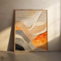 an abstract painting hangs on the wall