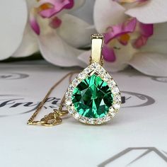 "This is gold emerald necklace.  This unique pear cut emerald and moissanite pendant necklace makes a great holiday gift idea. The emerald layering gold necklace is the May birthstone necklace for women. To revisit our shop click here: https://etsy.me/3Pzzwpx For more emerald necklace options click here: https://etsy.me/3Td2gnv For emerald earrings click here: https://etsy.me/3AN4nqW  The Pendant pictured is a lab created center stone and moissanite halo#7917 Shown with lab created blue sapphire Gold Emerald Necklace, Necklace Emerald, Moissanite Pendant, Lab Created Emerald, Solid Gold Necklace, May Birthstone, Emerald Necklace, Green Sapphire, Emerald Earrings