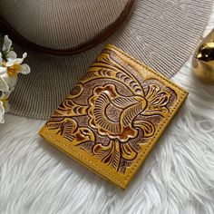 Indulge in the charm of artisanal craftsmanship with our exquisite collection of leather wallets for women!  Each piece is meticulously crafted, exuding elegance and individuality. All our  leather wallets for women are handcrafted one at a time  We ship worldwide from Hawai'i USA  IMPORTANT: If your heart is set on a specific color get it while supplies lasts!  Because all our women wallets are handmade with sustainable leather, we do not have any specific dates to re-stock any item. * 3 Credit Card Slots,  * 1 Bill compartment  * ID window  * Labor Time: 6 Hours * 3.5" x 4" ( 9 x 10 cm)  * Sustainable goat leather  WHATS OUR STORY?  Our team of artisans have a passion for working with leather that has been passed down through generations. We take pride in creating beautiful and sustainab Elegant Yellow Leather Wallet, Artisan Rectangular Card Holder As Gift, Artisan Rectangular Card Holder Gift, Elegant Embossed Rectangular Wallets, Artisan Handmade Card Holder For Gifts, Traditional Brown Wallet For Gift, Traditional Brown Wallets For Gifts, Traditional Brown Wallets As Gifts, Gold Leather Coin Purse As Gift