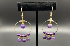 Handmade purple bead drop hoop earrings. Purple Metal Beaded Drop Earrings, Purple Dangle Hoop Earrings With Ear Wire, Purple Hoop Earrings As Gift, Purple Metal Dangle Earrings, Purple Small Hoop Earrings For Pierced Ears, Nickel-free Purple Beaded Earrings With Round Beads, Purple Dangle Hoop Earrings, Purple Dangle Metal Earrings, Small Purple Hoop Earrings For Pierced Ears