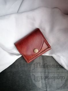 Made with top quality 100% Italian leather, hand-sewn with a resistant and repairable waxed thread, the leather is first colored by hand and then treated with a special cream that protects it and keeps it soft. Completely handmade. This mini wallet with a minimal, compact and slim design is perfect to keep in your pocket and is useful in all those situations where you need to have credit cards, documents and banknotes with you, but you don't have room for a normal wallet thick and chunky. The petite size and thinness makes it a perfect complement to the belt bags used by those who attend festivals, concerts or love bushcraft! Being able to insert it in pockets, even inside jackets, also allows you to avoid being robbed on public transport and when you are in areas crowded with people. It c Brown Leather Trifold Wallet With Waxed Finish, Vintage Leather Wallet With Waxed Finish, Vintage Leather Wallets With Waxed Finish, Leather Coin Purse With Leather Lining For Daily Use, Hand-stitched Leather Card Holder For Everyday Use, Hand-stitched Leather Trifold Wallet, Brown Waxed Finish Wallets As Gifts, Brown Leather Coin Purse With Card Slots, Classic Leather Trifold Wallet Hand-stitched