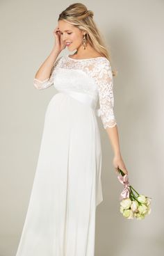 Fall in love with our classic yet ultra-modern maternity bridal gown, Olivia. Designed with the softest ivory stretch lace on the bodice and a silky soft sheen jersey to the skirt. Scallop edging adorns the v-back lace neckline and sleeves whilst the upper bodice is left elegantly sheer. With an empire line waist and gentle gather and stretch for the perfect fit, you will glide down the aisle in both comfort and style. Sheer floral lace with subtle stretch Lightweight silky satin jersey skirt Sc Elegant White Maternity Dress With Lace Trim, White Lace Maternity Dress For Wedding, White Lace Maternity Wedding Dress, Elegant White Lace Maternity Dress, White Lace Maternity Gown, Fitted Maternity Dress With Lace Bodice, Fitted Maternity Dress With Lace Sleeves, Fitted Lace Maternity Dress For Wedding, Fitted Maternity Dress With Sweep Train For Wedding