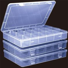 three clear plastic storage boxes stacked on top of each other with dividers in them