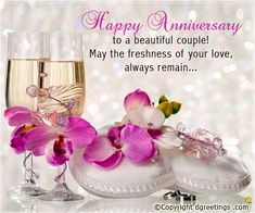 an anniversary card with pink flowers and champagne