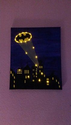 a painting of a bat flying over a city at night with lights on it's side