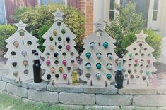 several wine bottles are lined up in the shape of christmas trees