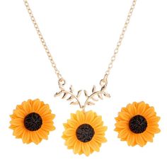 three sunflower necklaces and earrings on a white background